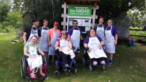 Leaders In Training - the group poses by a sign